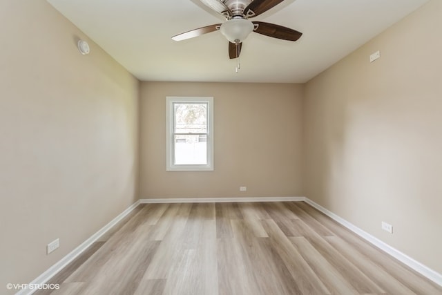 empty room featuring ceiling fan and light wood-type flooring