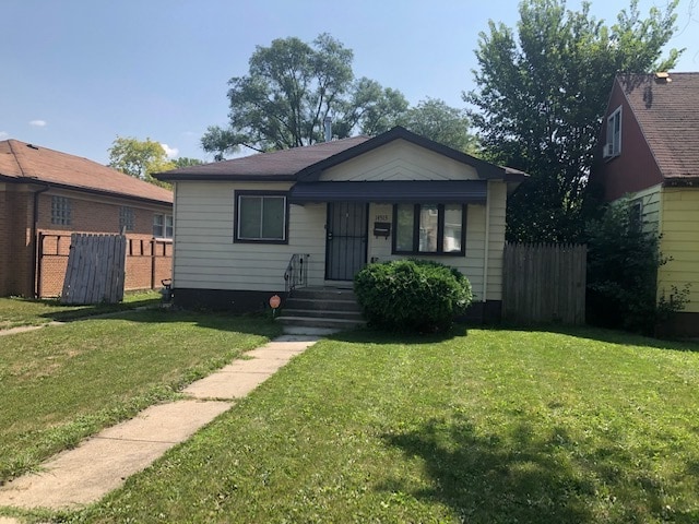 bungalow with a front lawn