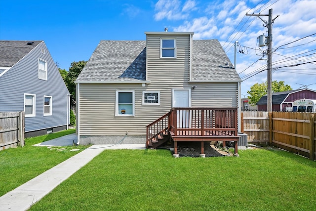 back of property with a yard and a patio