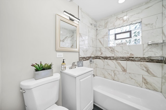 full bathroom with toilet, tiled shower / bath combo, and vanity