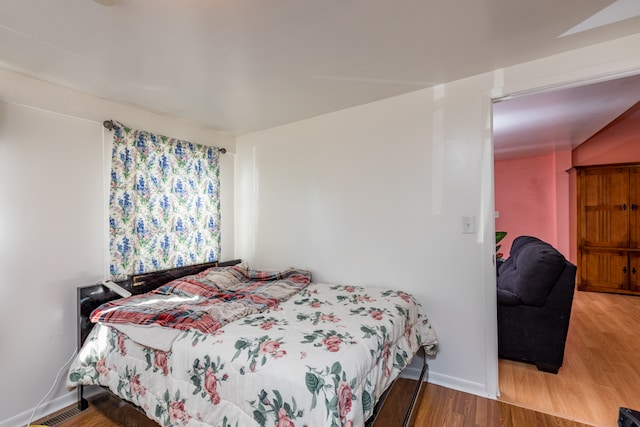 bedroom featuring hardwood / wood-style floors