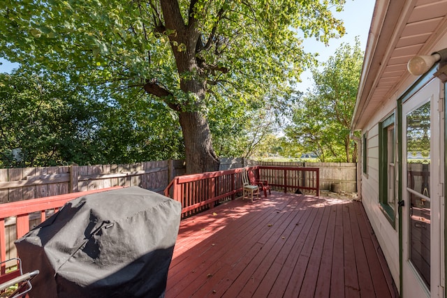 wooden terrace featuring grilling area