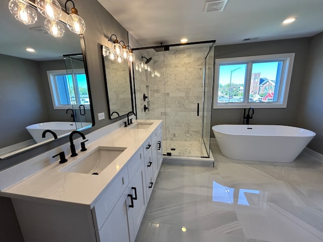 bathroom with vanity, a healthy amount of sunlight, tile patterned floors, and plus walk in shower