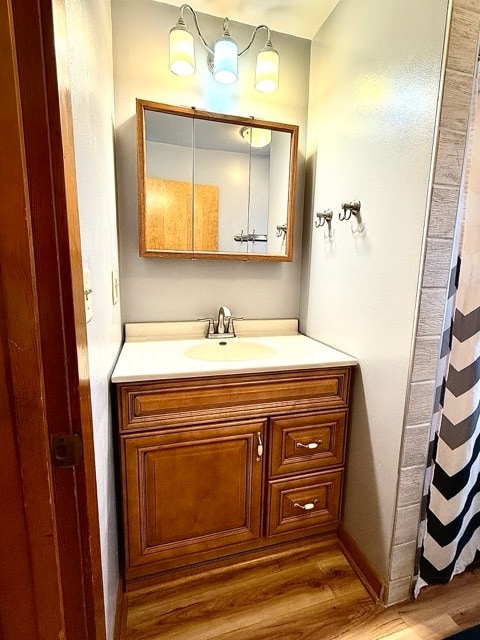 bathroom with vanity and hardwood / wood-style floors