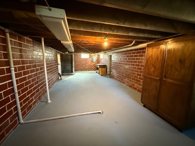 basement with brick wall