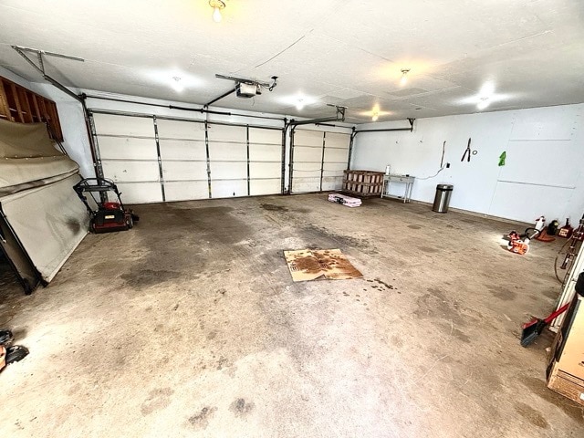 garage featuring a garage door opener