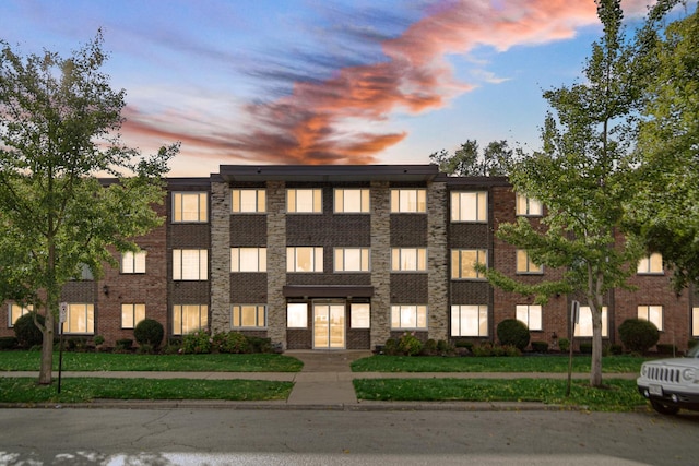 view of outdoor building at dusk