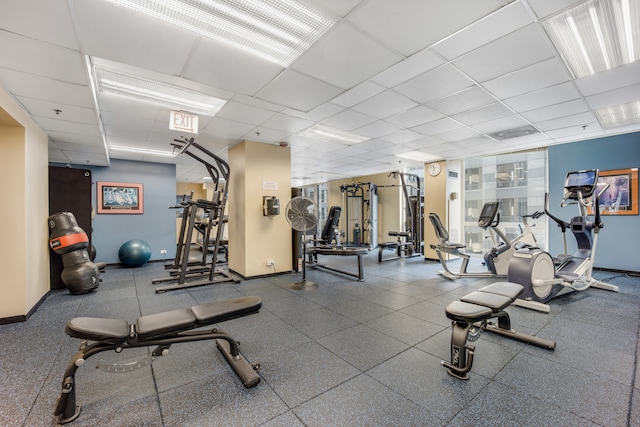 workout area featuring a drop ceiling