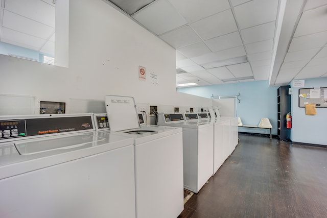 washroom featuring independent washer and dryer and dark hardwood / wood-style floors