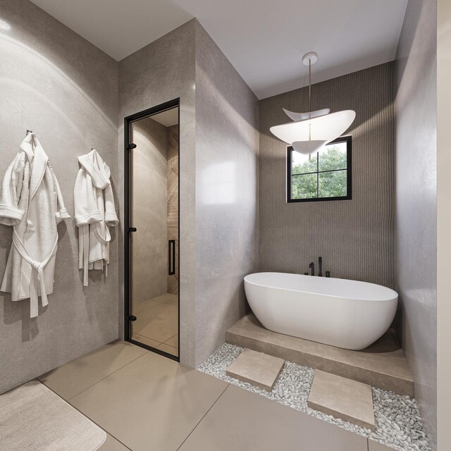 1342 W Wellington Ave, Chicago, IL 60657 - full bathroom featuring a freestanding tub, a stall shower, and tile patterned floors