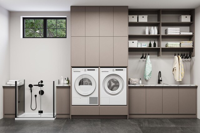 1342 W Wellington Ave, Chicago, IL 60657 - clothes washing area featuring a sink, cabinet space, and washer and clothes dryer