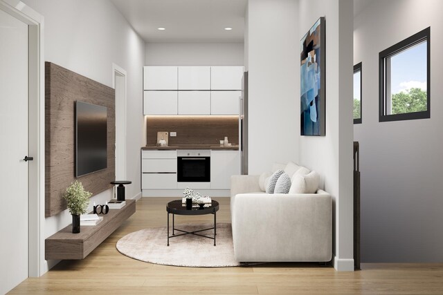 1342 W Wellington Ave, Chicago, IL 60657 - living room with recessed lighting and light wood-style floors