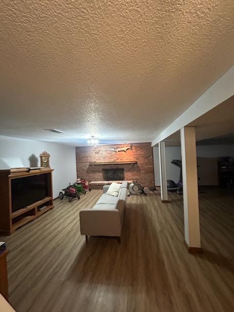 interior space featuring a textured ceiling and hardwood / wood-style flooring