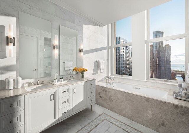 bathroom featuring vanity and shower with separate bathtub