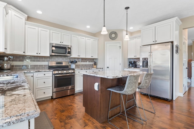 kitchen with white cabinetry and appliances with stainless steel finishes