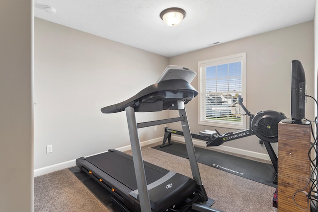 workout room with dark colored carpet