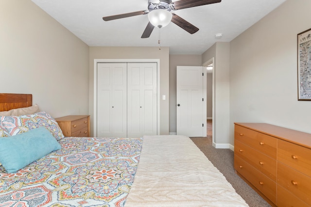 bedroom with a closet, ceiling fan, and dark carpet