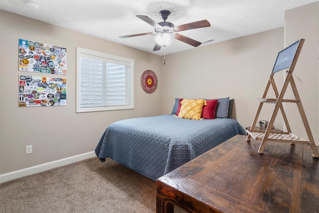 bedroom featuring ceiling fan and carpet