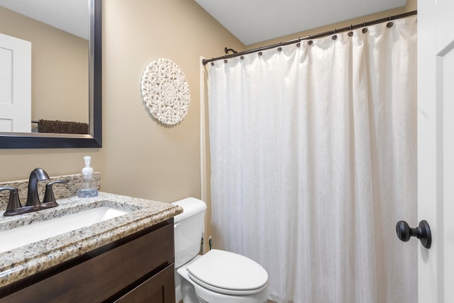 bathroom featuring toilet, a shower with curtain, and vanity