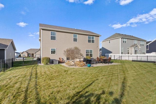 back of property with a patio, central AC, and a lawn