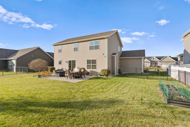 rear view of property with a patio and a yard