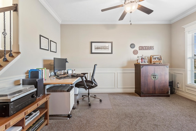 home office featuring ceiling fan, ornamental molding, and light colored carpet