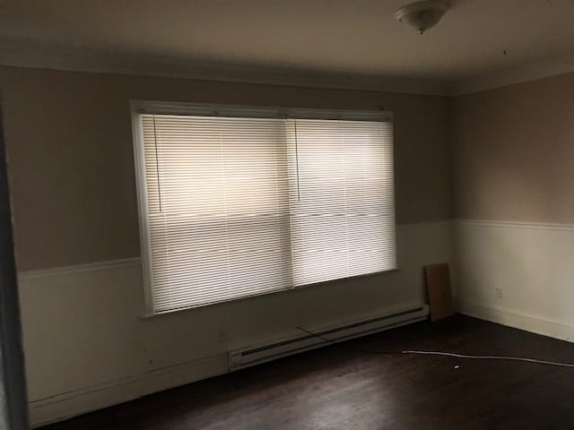 empty room with a baseboard heating unit