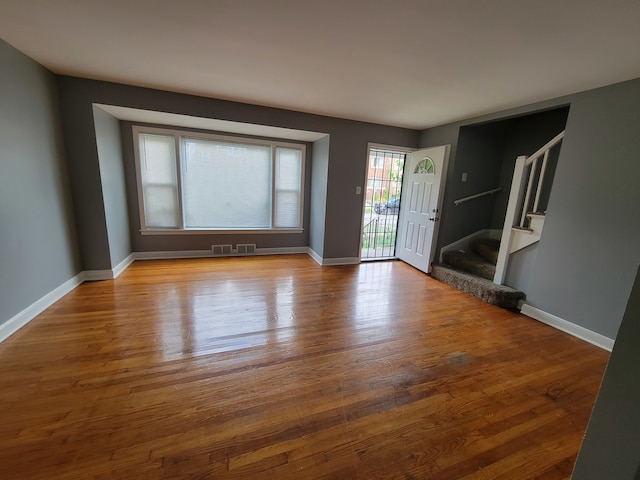 spare room featuring light hardwood / wood-style floors