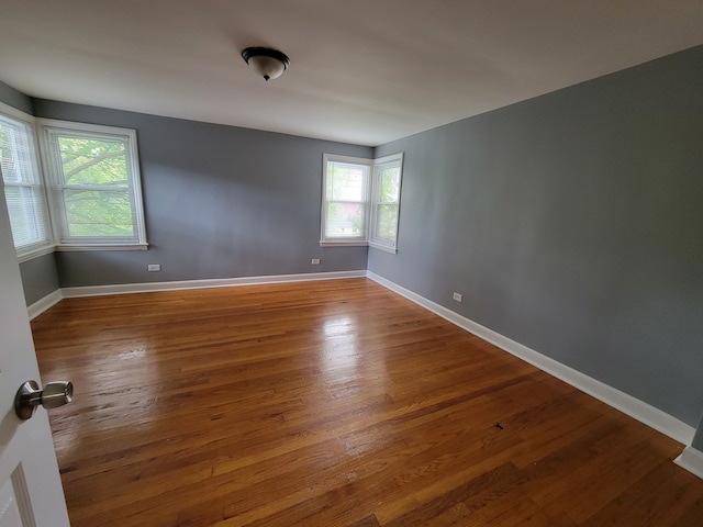 spare room featuring hardwood / wood-style flooring