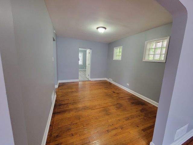 spare room with wood-type flooring