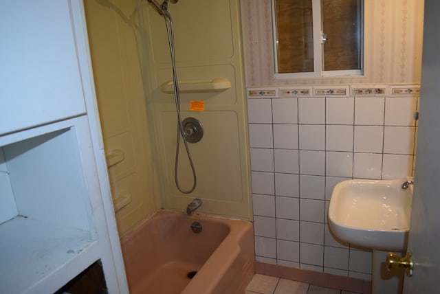 bathroom with tile patterned floors, tile walls, and shower / bath combination