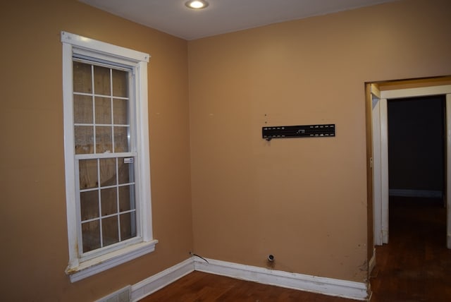 unfurnished room featuring dark hardwood / wood-style floors