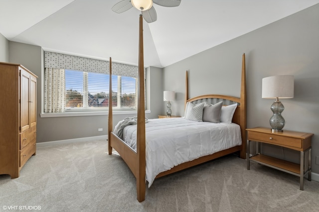 bedroom with ceiling fan, lofted ceiling, and light carpet