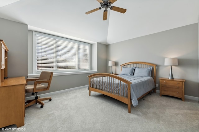 carpeted bedroom with vaulted ceiling and ceiling fan