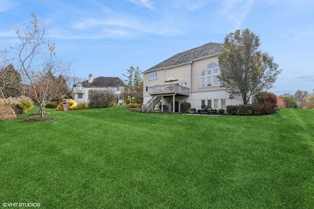 view of yard featuring a wooden deck