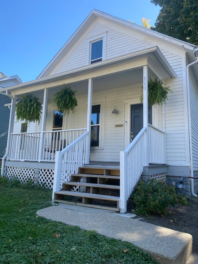 entrance to property featuring a porch