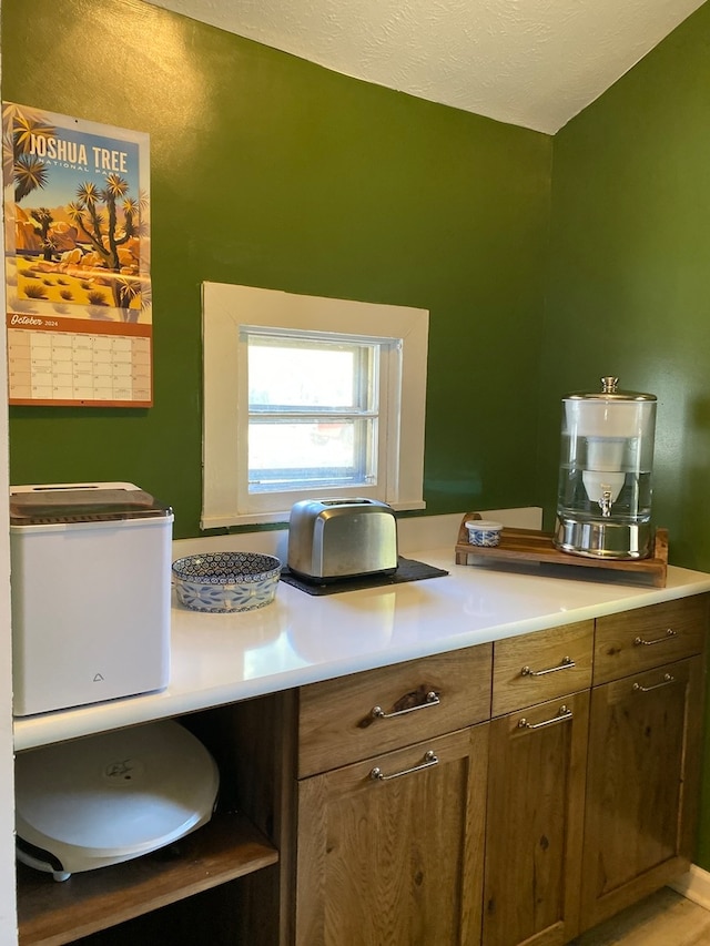 kitchen featuring a textured ceiling