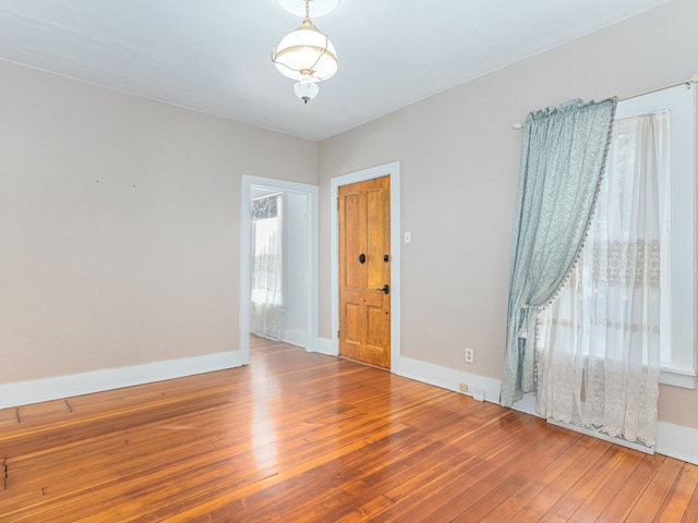 empty room with wood-type flooring