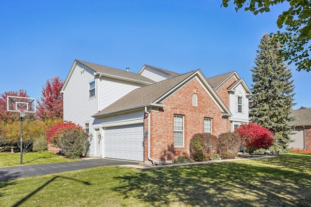 view of front property featuring a front yard and a garage