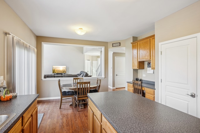 kitchen with dark hardwood / wood-style floors