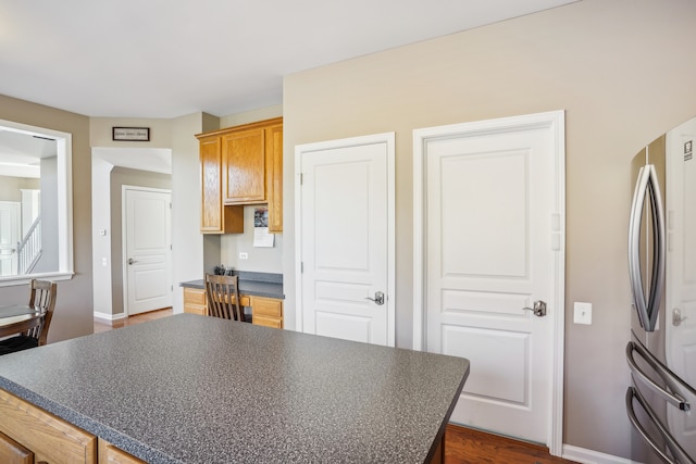 kitchen featuring stainless steel refrigerator