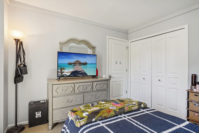 carpeted bedroom featuring a closet