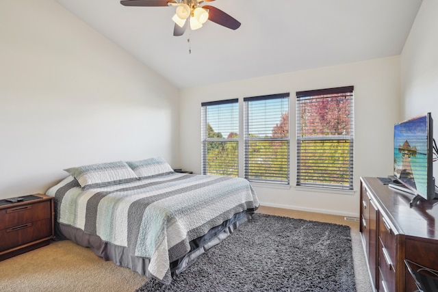 bedroom with lofted ceiling, carpet flooring, and ceiling fan