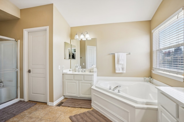 bathroom featuring vanity, tile patterned floors, and shower with separate bathtub