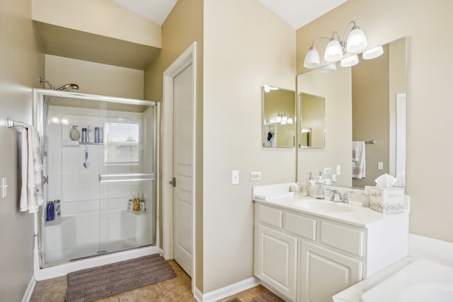 bathroom featuring vanity, tile patterned floors, and walk in shower