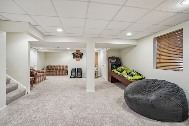 playroom featuring carpet floors and a paneled ceiling