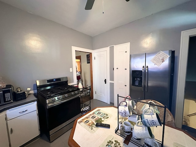 kitchen with white cabinets, stainless steel appliances, and ceiling fan