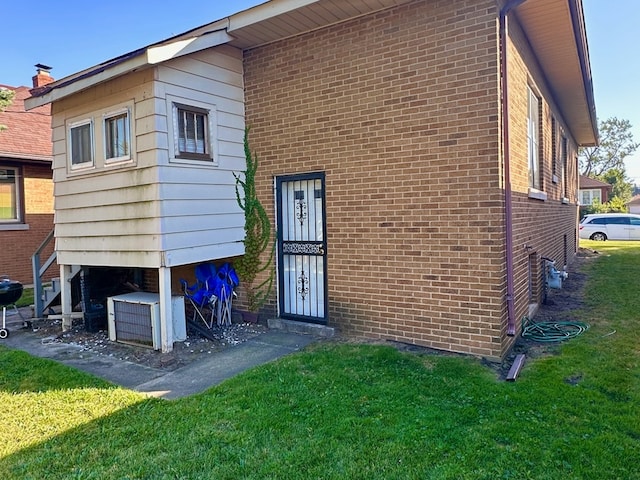 rear view of property with a yard