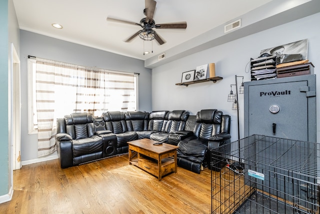 living room with ceiling fan and hardwood / wood-style flooring