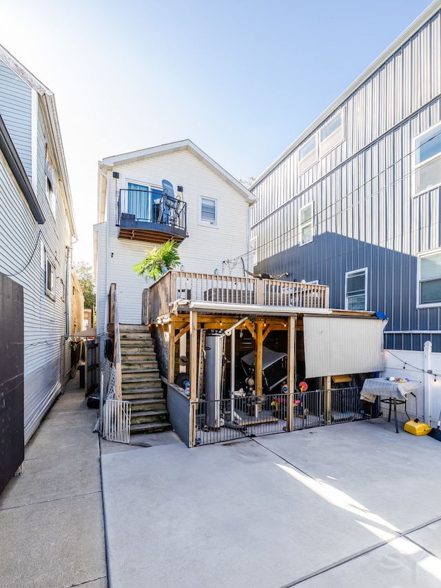 back of house featuring a deck